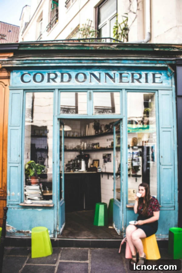 10 Paris Insider Spots: Experience the City Like a Local 5 blue facade of the Boot Cafe in Paris (non touristy things to do in Paris)