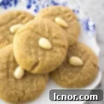 A plate of almond cookies, golden brown and perfectly baked.