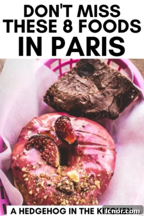 Close-up of doughnuts & a chocolate brownie in a pink basket, representing delicious foods to try in Paris