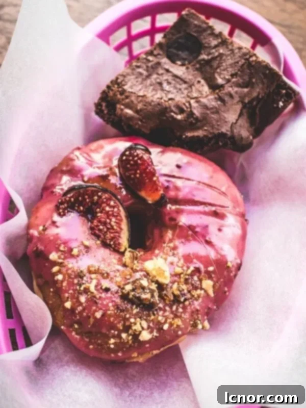 A close-up of a delectable doughnut and a rich chocolate brownie, a modern Parisian sweet treat.