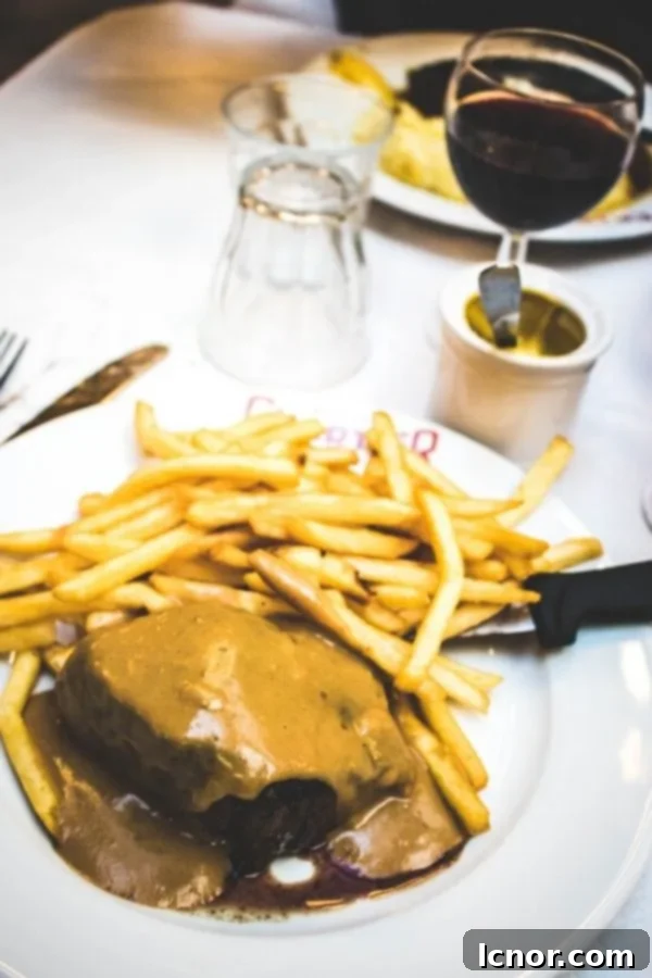 A delicious plate of steak frites, a classic and hearty French meal not to be missed in Paris.