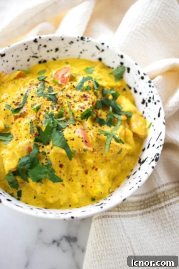 Delicious Chicken Karahi, an aromatic Indian curry, presented in a white and black bowl