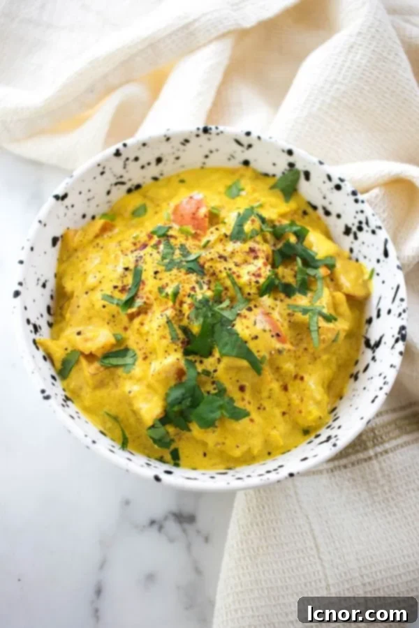 Flavorful Chicken Karahi served in a traditional black and white bowl, ready to be enjoyed