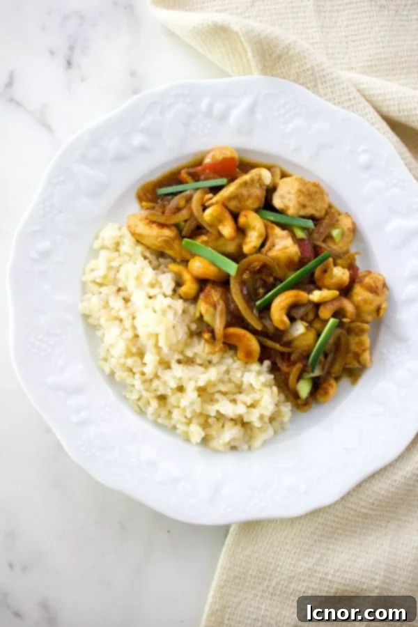 Siam Cashew Chicken Stir-Fry 2 Thai cashew chicken with white rice on a white plate