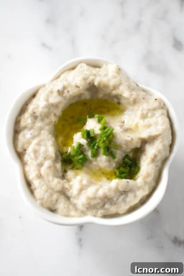 Smoky Melitzanosalata Greek Eggplant Dip 4 Melitzanosalata dip part of a mezzo platter on a white marble background