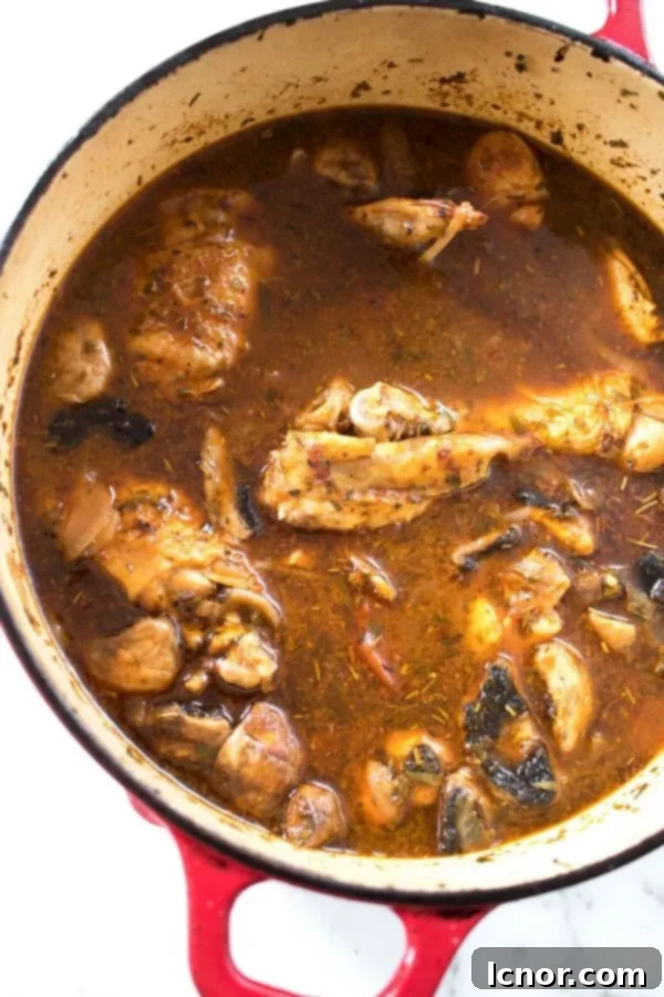 a Dutch Oven filled with French Chicken Chasseur stew