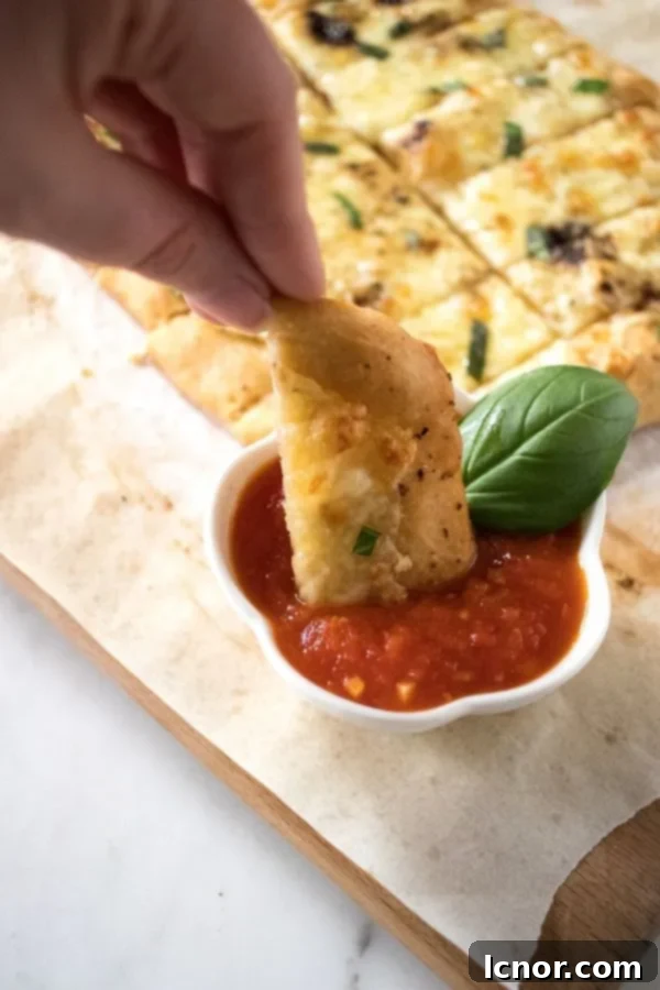 dipping Italian dunkers into marinara sauce