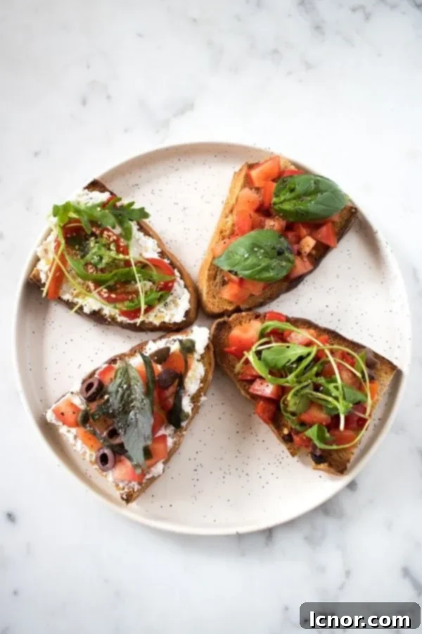 A beige speckled plate featuring a collection of bruschetta slices, generously topped with fresh tomatoes, vibrant basil leaves, black olives, hints of garlic, and a luxurious drizzle of olive oil.