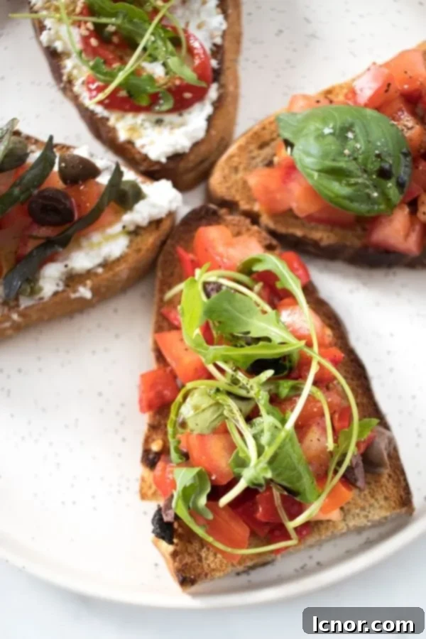 An appetizing bruschetta slice loaded with vibrant red peppers, diced tomatoes, and fresh arugula or rocket salad, served on toasted bread.