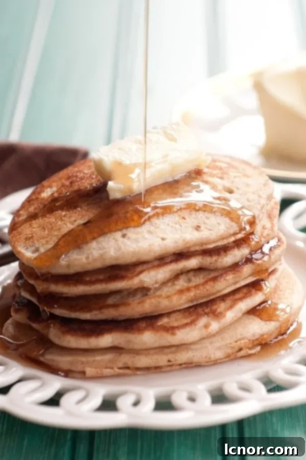 A stack of golden brown sourdough discard pancakes.