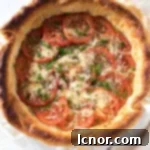 French tomato tart topped with tomatoes and cheese