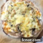 sourdough pizza with cheese and mushrooms on a wooden board