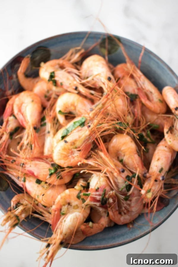 Platter of golden French Garlic Shrimp, garnished with fresh parsley, ready to be served as an appetizer.