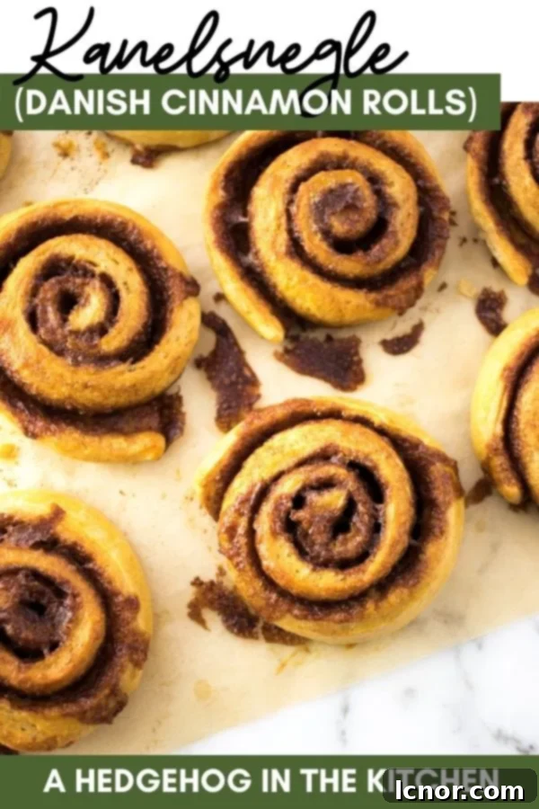 A beautifully styled image of Kanelsnegle Danish Cinnamon Rolls, ready to be pinned on Pinterest