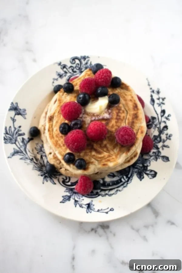 Sourdough Pancakes on a blue and white plate