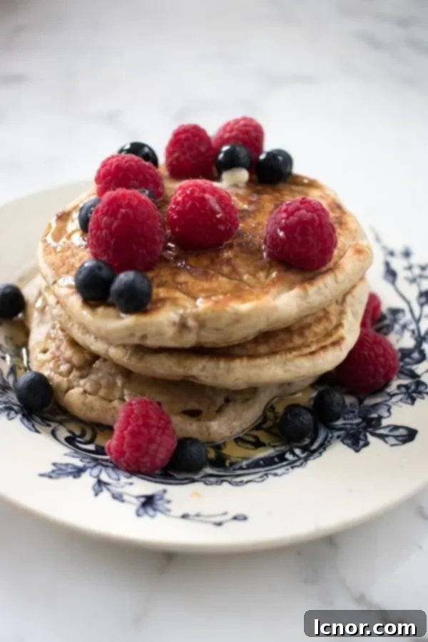 stack of pancakes on a blue and white floral plate