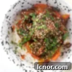 Sweet and Sour Pork Kou Lou Yuk on white rice in a bowl