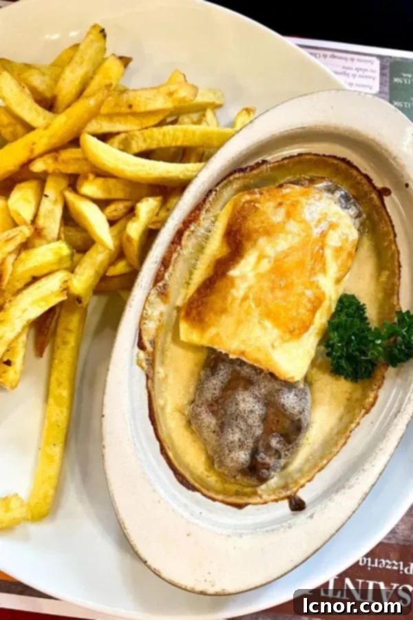A plate of andouillette and French fries, a local specialty in Troyes France