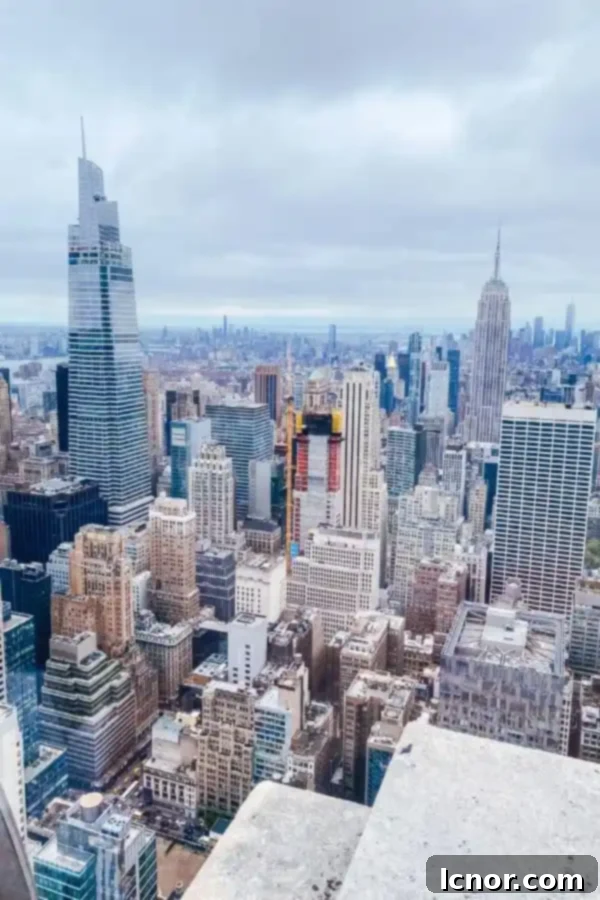 Panoramic view of New York City from Top of the Rock, featuring the Empire State Building and Central Park.