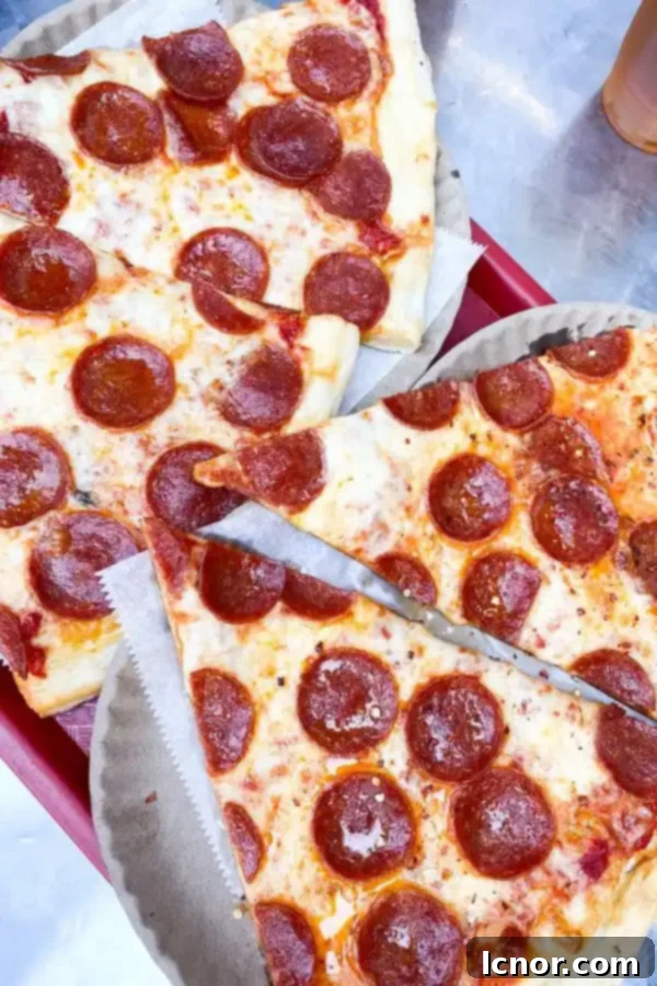 A classic slice of New York City pizza, a must-try during your 4-day NYC trip.