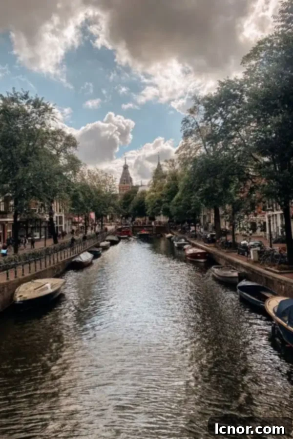 Picturesque Amsterdam canals with historic buildings, perfect for a 2-day trip