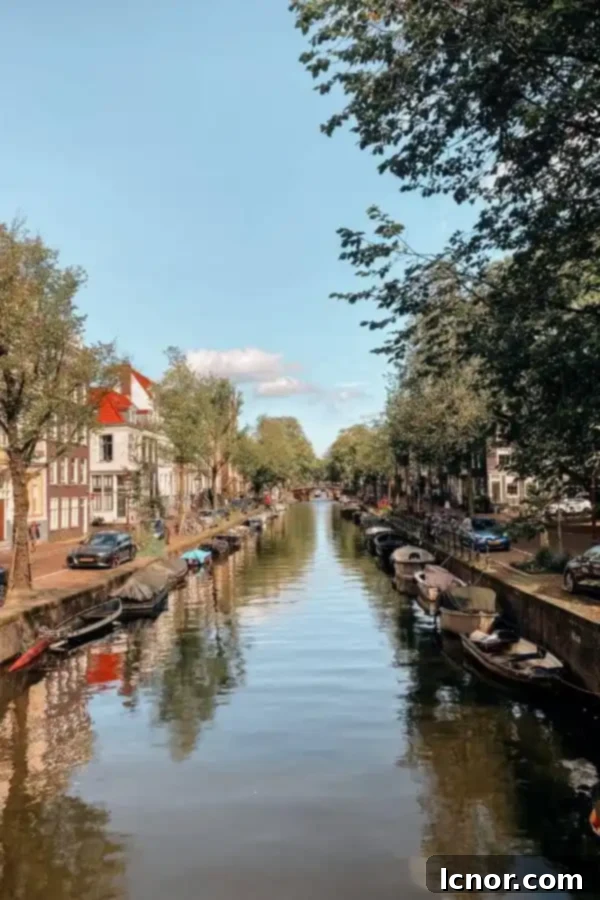 Charming canal with historic gabled houses in Amsterdam, part of a perfect 2-day trip