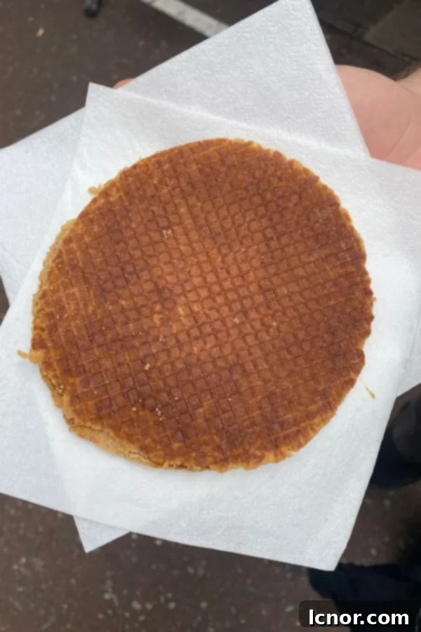 Close-up of a warm, fresh stroopwaffel, a sweet treat during your Amsterdam visit
