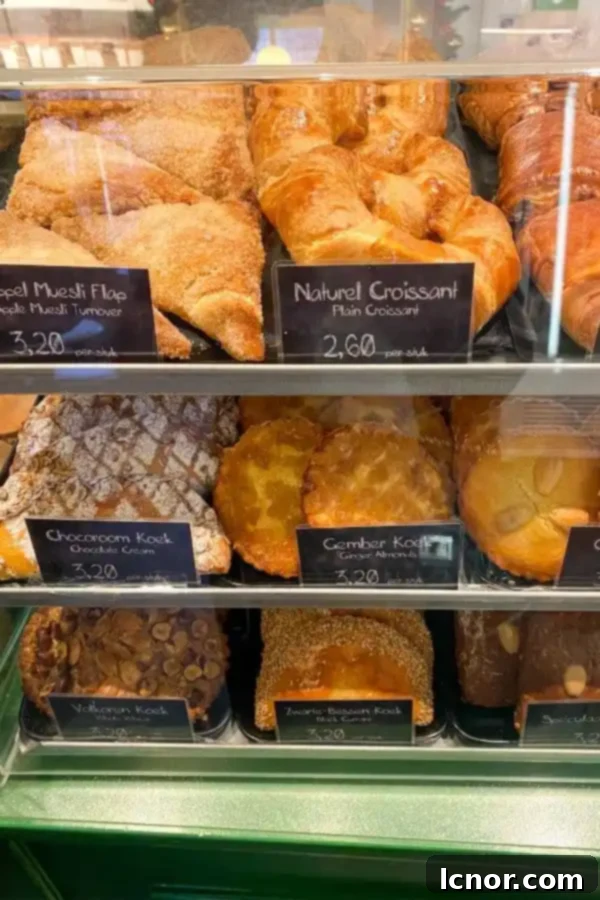 A delightful display of pastries and sweet treats at Lanskroon Bakery Amsterdam, showcasing a variety of traditional Dutch delights.