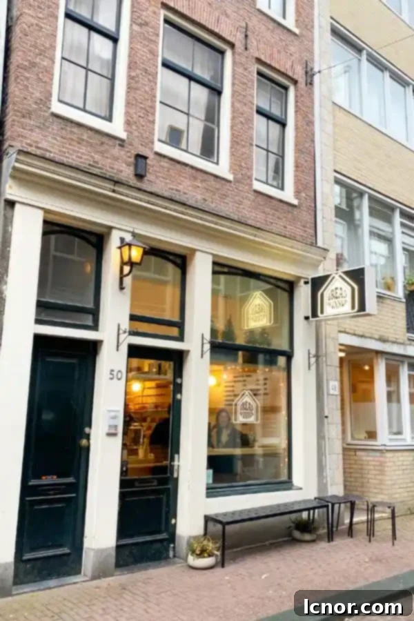The charming storefront of Breadwinner Amsterdam, inviting passersby into the world of authentic bagels.
