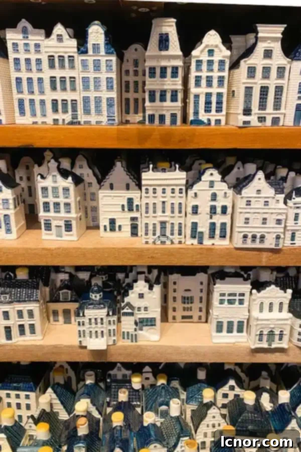 Display of vintage KLM Delft houses for sale, a popular authentic Amsterdam souvenir.