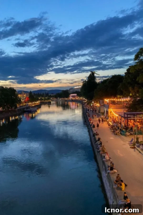 Romantic things to do in Vienna, nighttime walk along the Danube Canal, couple walking