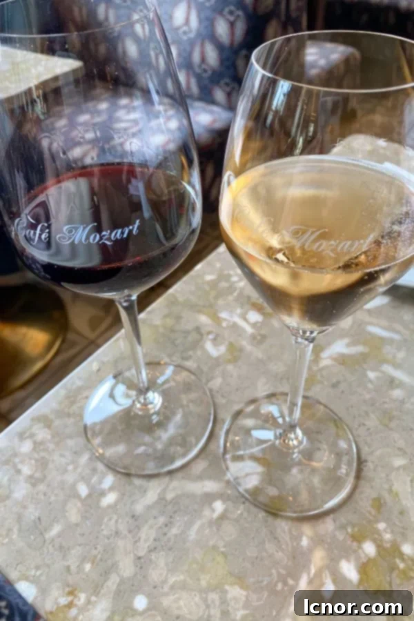 Two glasses of wine on a table in a Viennese cafe, romantic evening in Vienna, Austria