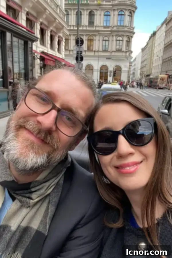 man and woman in a horse drawn carriage in Vienna