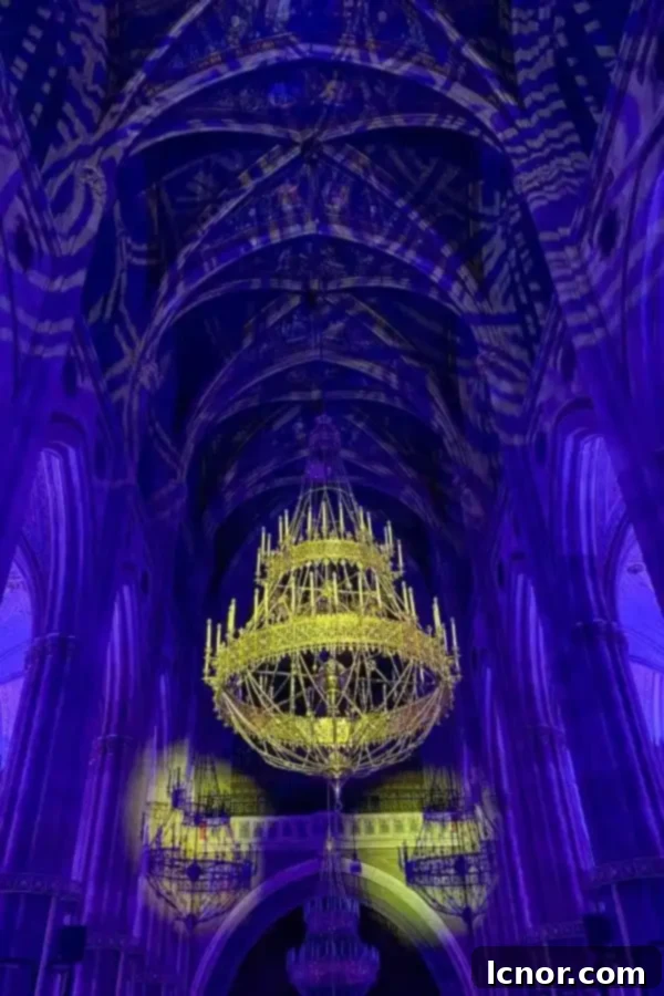 beautiful gold chandelier and blue lights at Light of Creation Vienna review