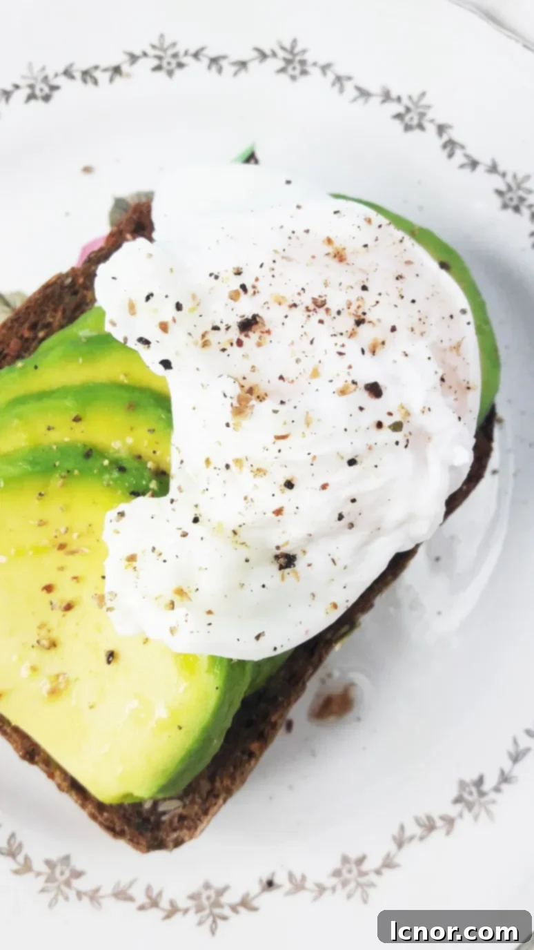 The BEST avocado toast recipe. This avocado toast is grainy, crunchy, has a layer of perfectly ripe, soft avocado and is topped with a runny poached egg. Avocado dreams do come true. | ahedgehoginthekitchen.com