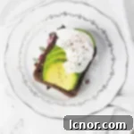The BEST avocado toast recipe. This avocado toast is grainy, crunchy, has a layer of perfectly ripe, soft avocado and is topped with a runny poached egg. Avocado dreams do come true. | ahedgehoginthekitchen.com