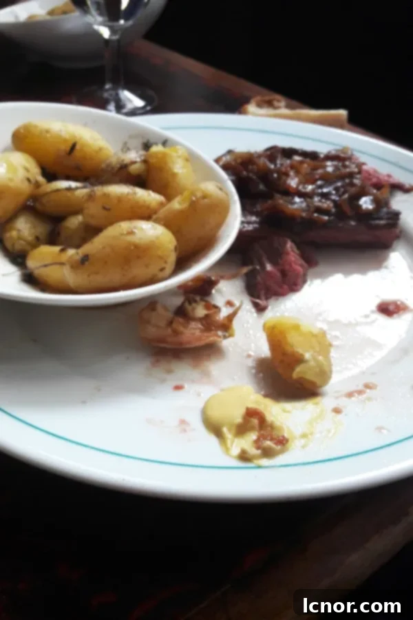 A perfectly cooked Bavette steak served with roasted potatoes at La Palette.