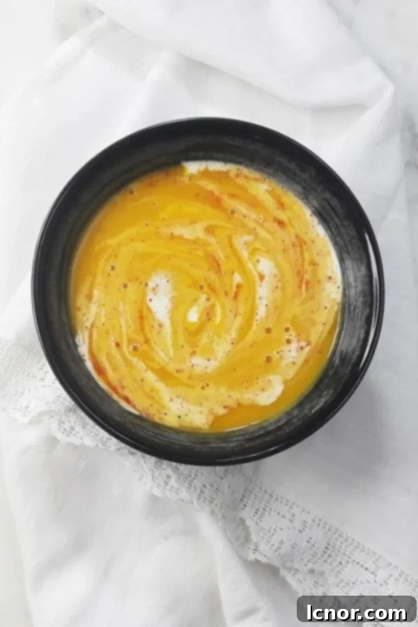 French pumpkin soup with a white lace background