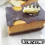Beautifully arranged homemade pumpkin cheesecake bars with a rustic, autumnal feel, perfect for a cozy dessert table.