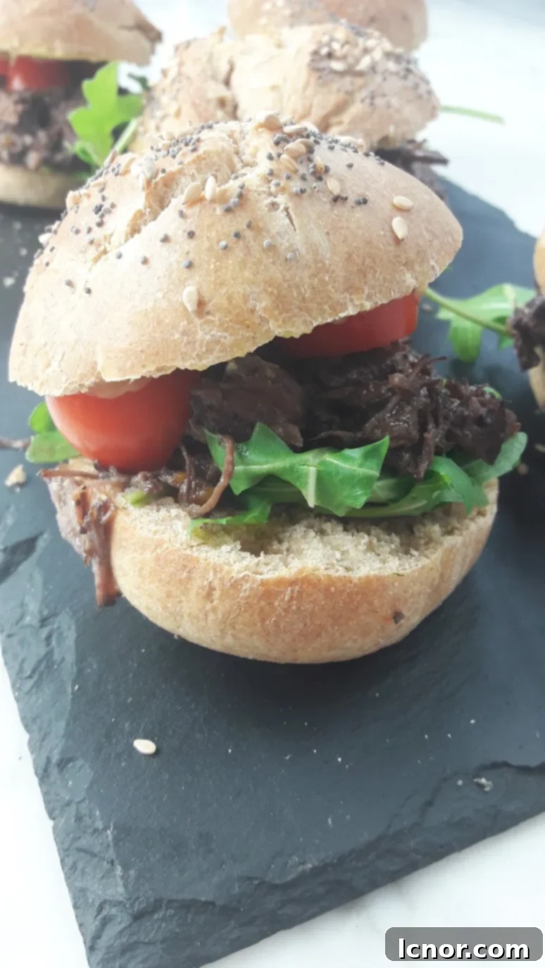 A plate full of mini Boeuf Bourguignon burgers, showcasing their perfect size and delicious appearance.
