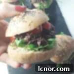 Mini Boeuf Bourguignon burgers with homemade poppy and sesame seed buns.