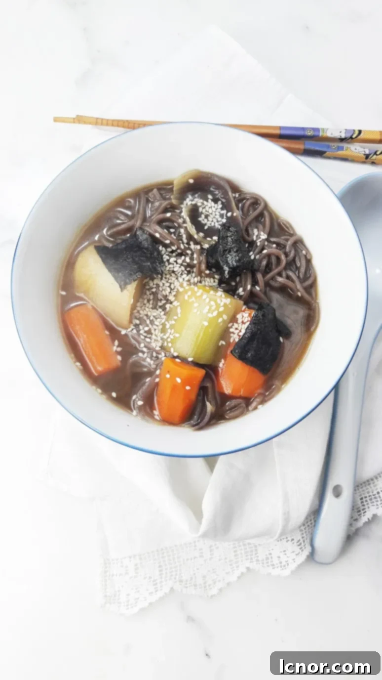 Delicious Miso Soup with Leeks and Carrots, garnished with seaweed.