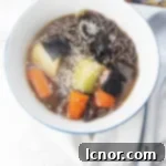 Delicious Miso Soup with Leeks and Carrots, garnished with seaweed and sesame seeds.