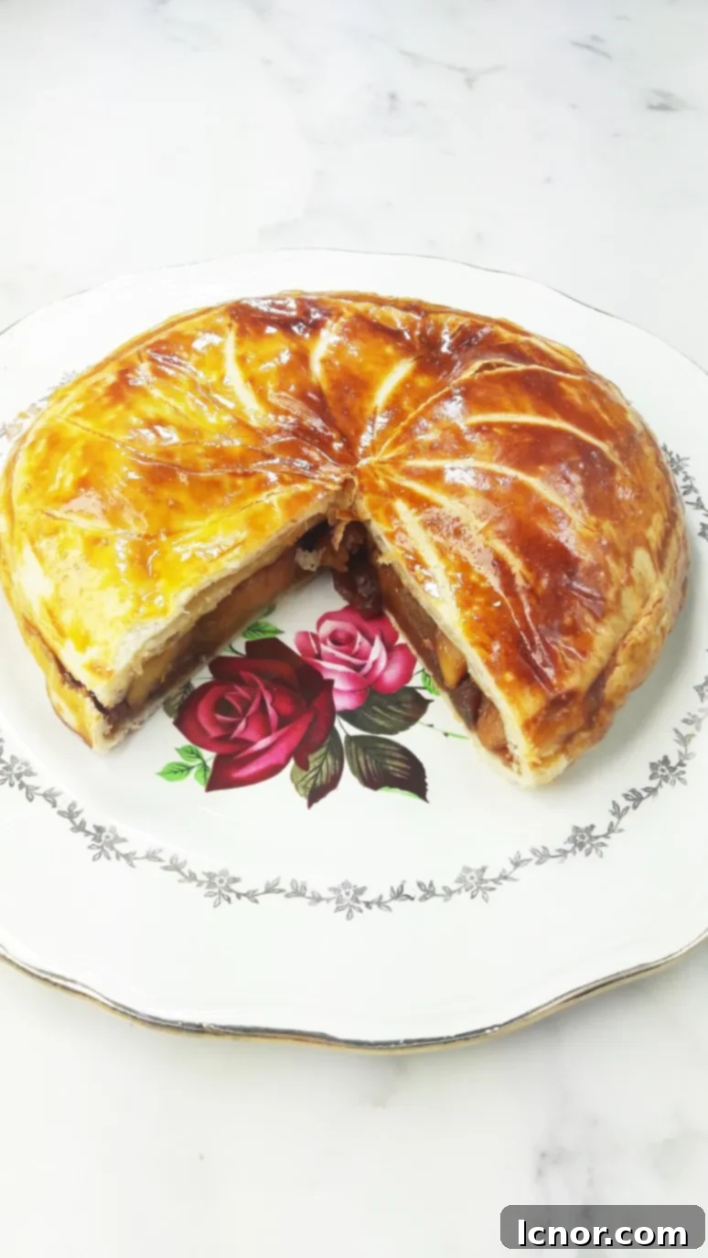 A close-up of the delicious filling of caramelized apples and honey in the galette. | ahedgehoginthekitchen.com