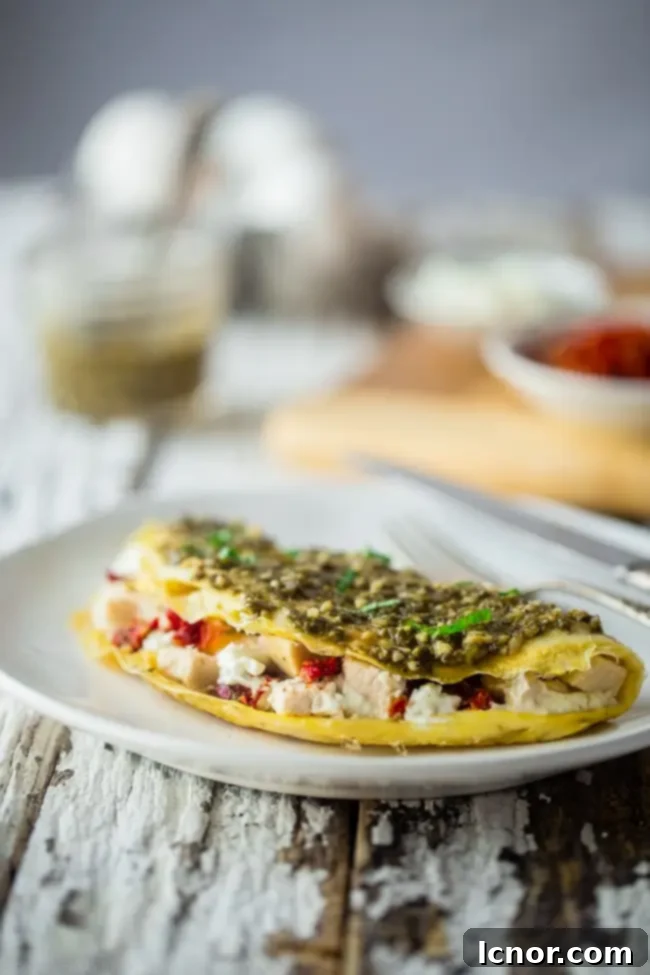 Romantic breakfast ideas for Valentine's Day? Pesto egg white omelette with goat cheese. | ahedgehoginthekitchen.com