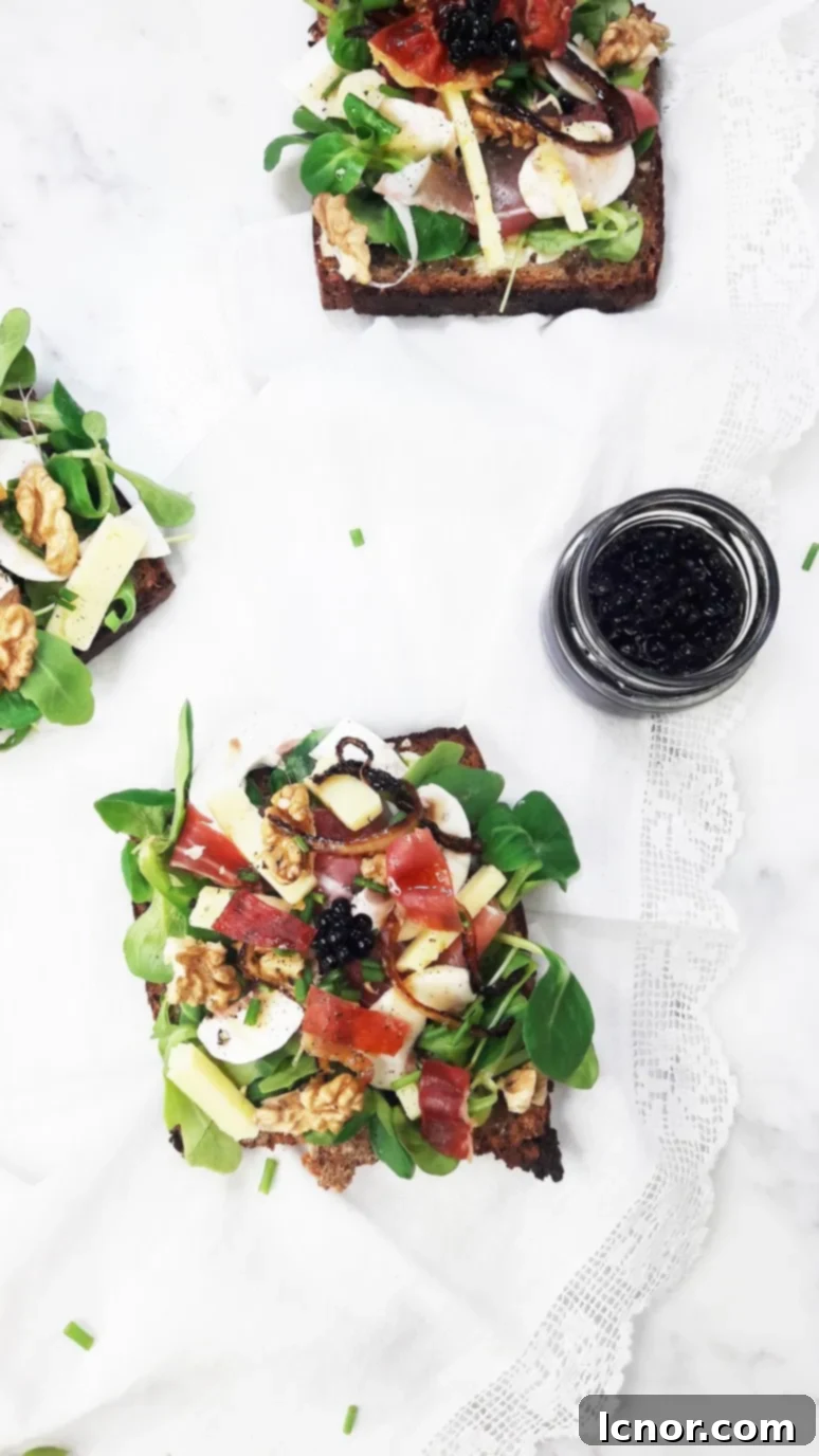 Close-up of the Bayonne Ham Laguiole Cheese & Balsamic Vinegar Tartine, highlighting the delicate balsamic pearls.