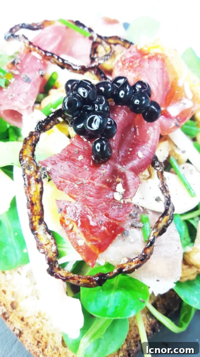 Three Bayonne Ham Laguiole Cheese & Balsamic Vinegar Tartines artfully arranged on a serving board.