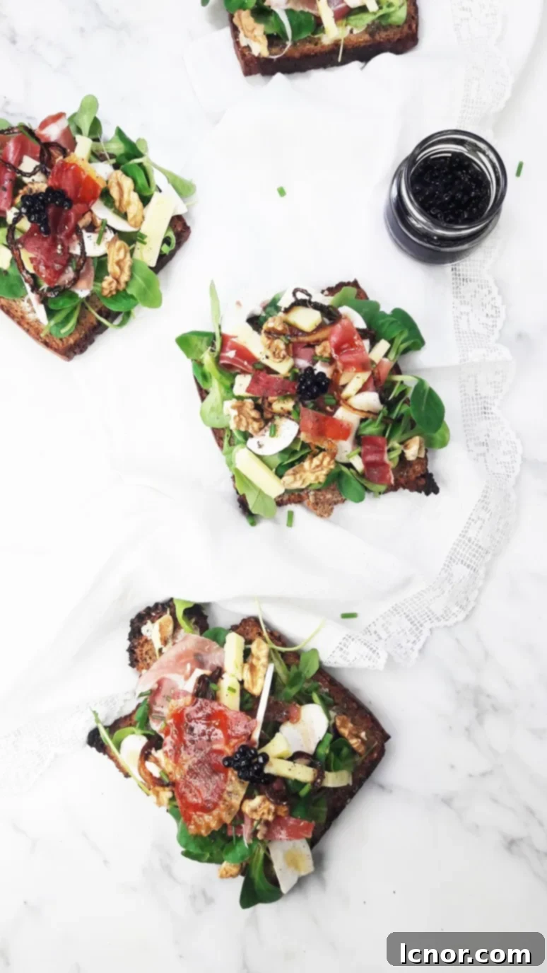 A close-up shot of a single tartine, emphasizing the fresh ingredients and elegant presentation.