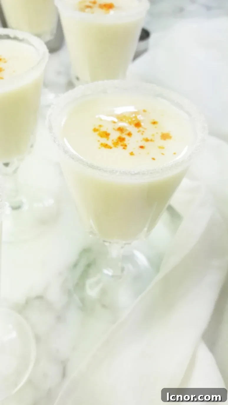 Ready-to-serve mini Pina Coladas with a chili-sugar rim, a unique twist.