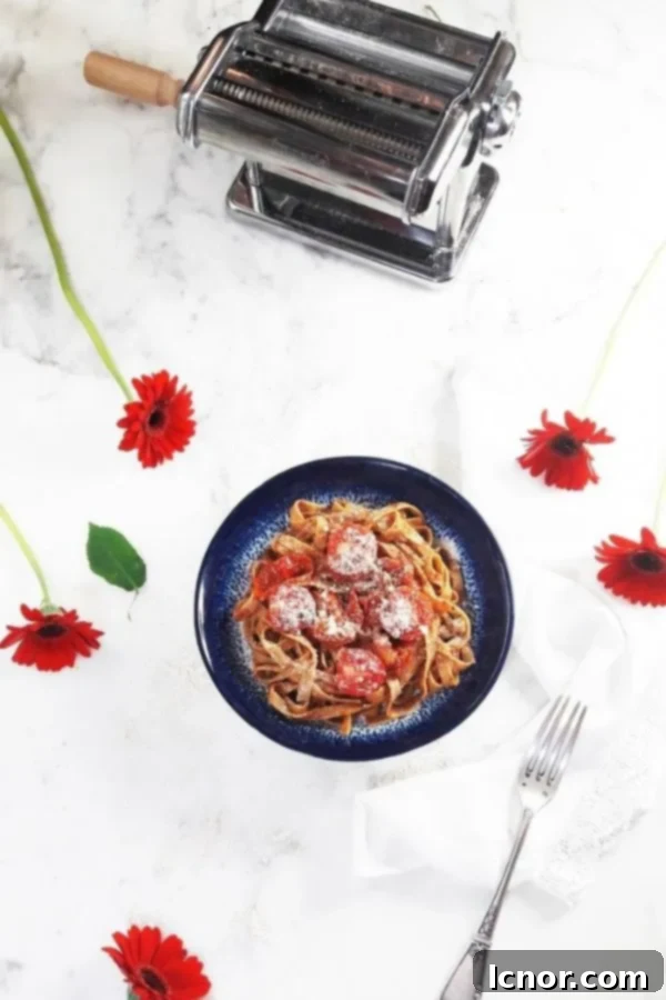 homemade ragu sauce with a pasta machine and red flowers